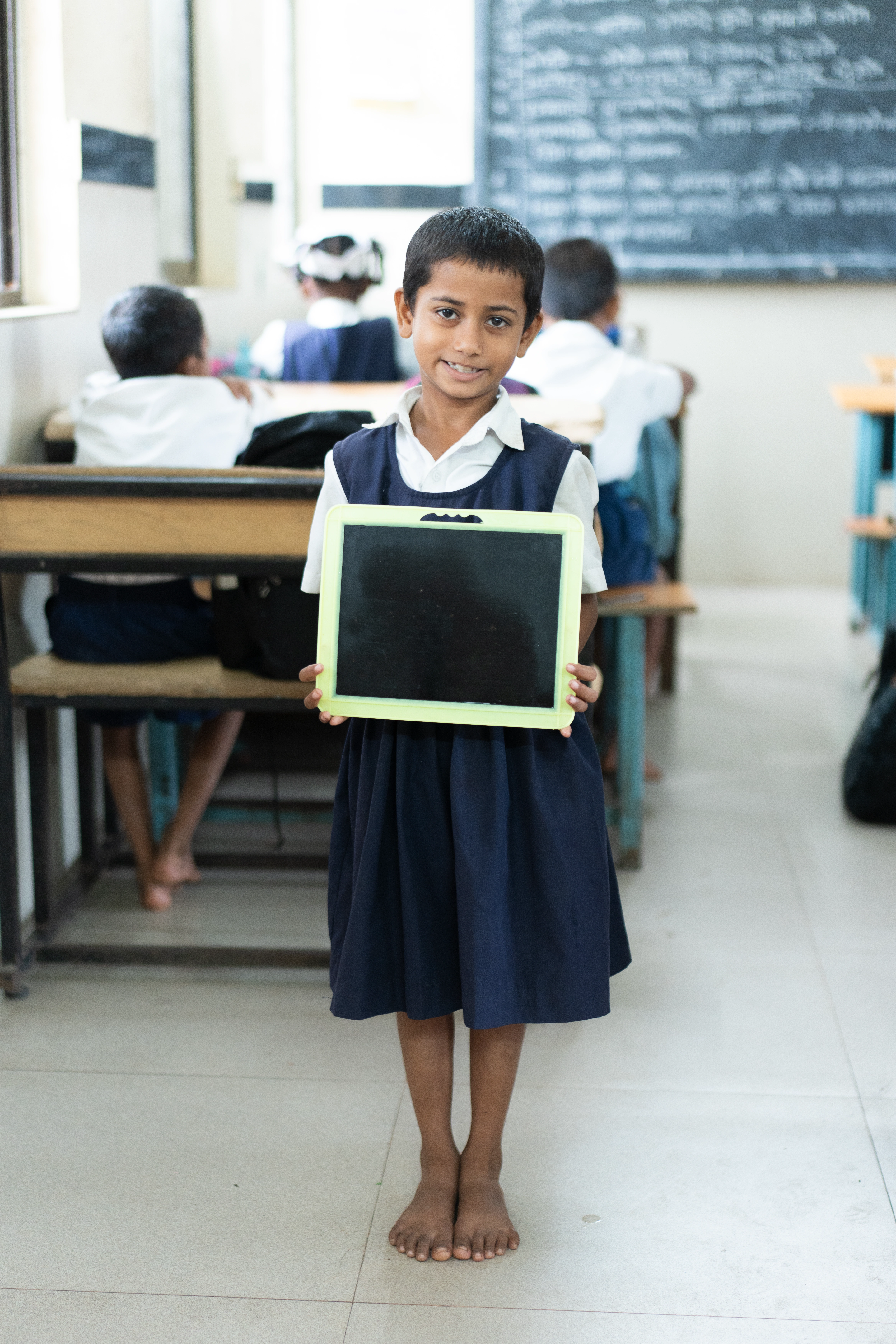 Student-Holding-a-Learning-Slate-in-Classroom